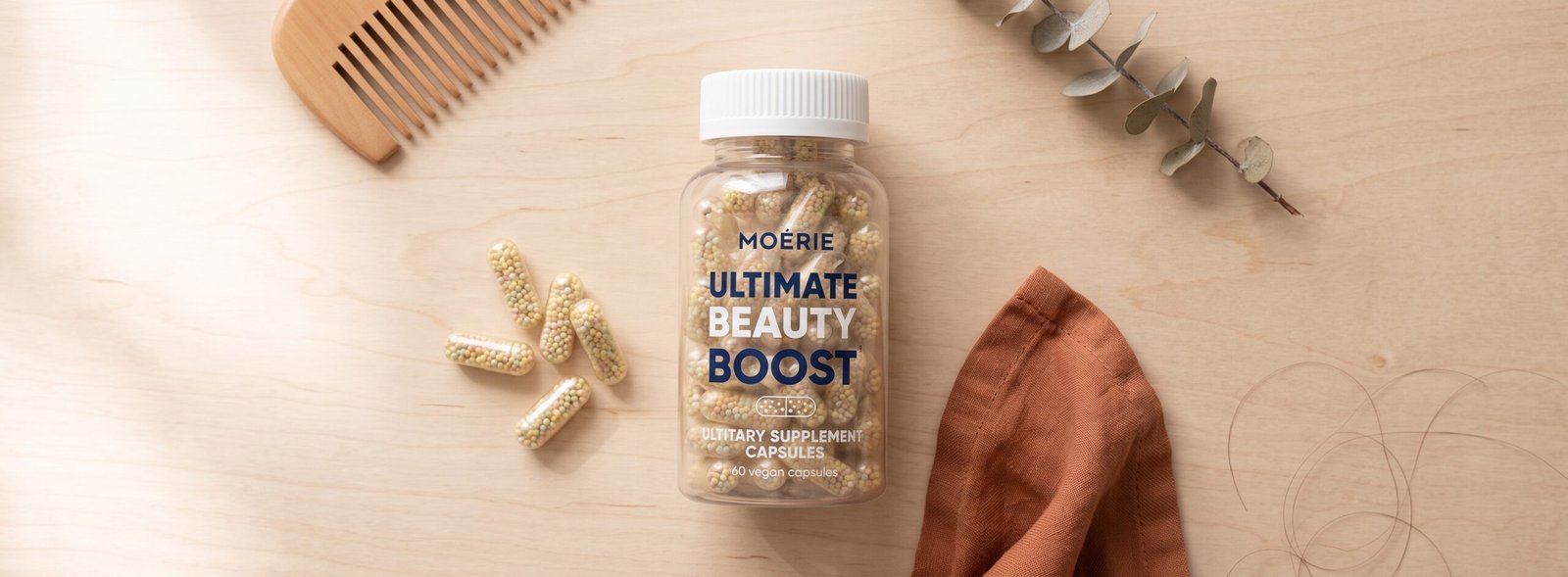 Moérie Ultimate Beauty Boost capsules flat-lay